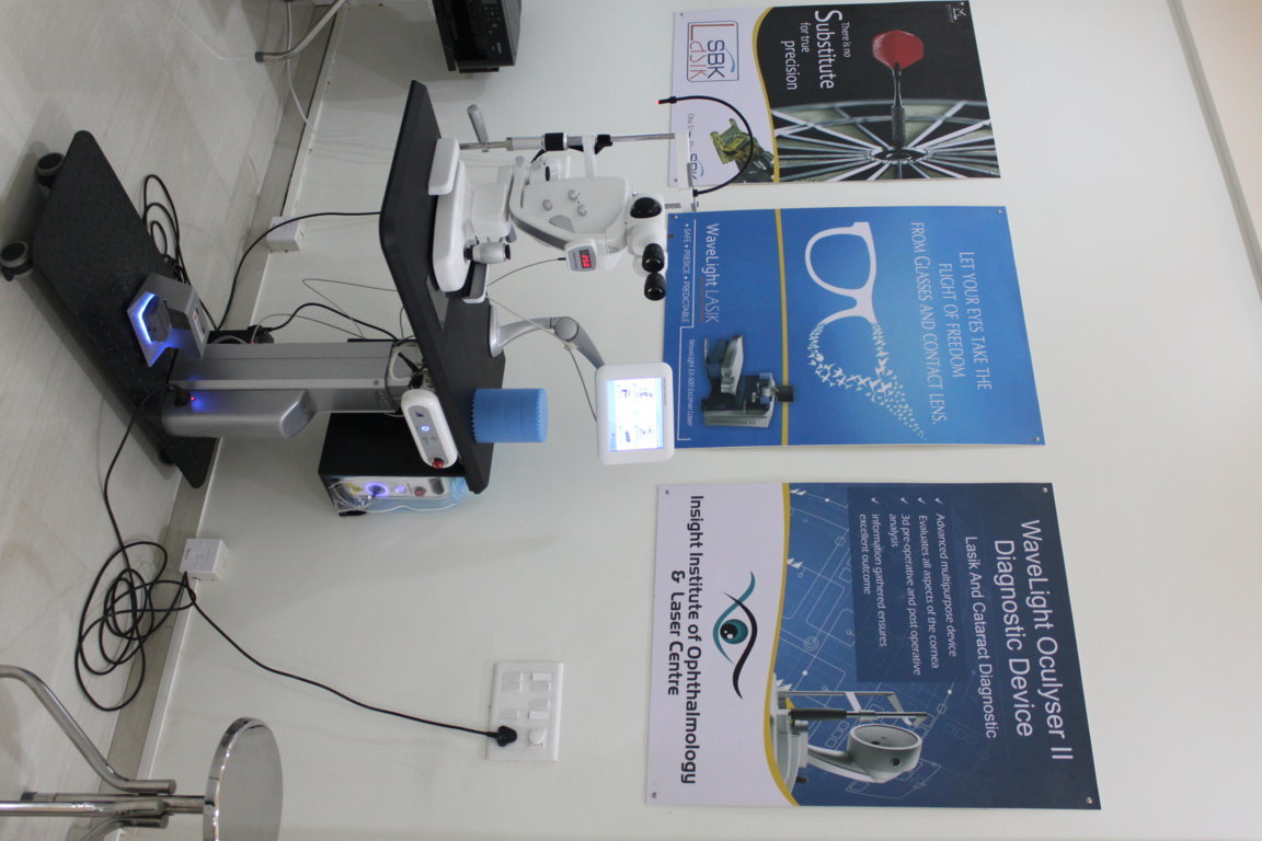 Slit-lamp diagnostic table at Insight Institute paired with WaveLight LASIK and Oculyser II Diagnostic Device patient information panels